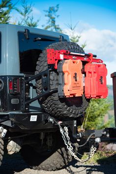 the back end of a jeep with chains attached to it