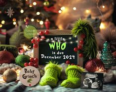 there is a sign that says a little who is due december 20 / 11 with christmas decorations around it