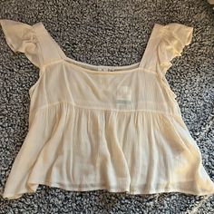 Brand New, Bought A Couple Years Ago From Dry Goods, Never Worn Flowy Summer Tops For Daytime, Cream Sleeveless Daytime Top, Cream Sleeveless Top For Daytime, Cream Flowy Short Sleeve Tops, Casual Cream Flowy Tops, Flowy Cream Short Sleeve Tops, Flowy Cream Casual Tops, Cropped Cream Top For Vacation, Cream Cropped Tops For Summer