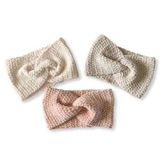 three crocheted headbands are shown with one knot in the middle and two on