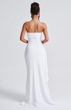 Feel like a siren in Zafira. our timeless maxi made in luxury double stretch crepe that moulds to your body for a heavenly fit. With a strapless neckline and ruched detailing. this showstopping look has a thigh high split and drape ruffle to one side.   Colour: White. Luxury double stretch crepe. Strapless. Ruched detailing. Moulds to body figure. Thigh high split. Drape ruffle detail. Maxi length. Model is an XS and is wearing an XS. Homecoming Dresses Corset, Midi Dress Wedding Guest, Dresses Flowy, Body Figure, Maxi Dress Sale, Strapless Neckline, Sparkle Dress, Stretch Crepe, Dresses By Length