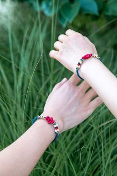 RED & BLUE ENCHANTING ROMANCE LUCKY KNOT BRACELET embodies the promise of the luck of peach blossom, signifying opportunities in love. White represents purity, while the golden threads signify preciousness, making the peach blossom knot a symbol of cherished and safeguarded love opportunities. This specific Lucky Knot is a typical Chinese decorative macrame knot, also called Ruyi Knot. Red, with the color of love and passion, combined with the knot type that symbolizes luck and fortune, the brac Lucky Bracelet, Bracelet Love, Macrame Knot, Peach Blossom, Knot Bracelet, Braided Bracelet, Peach Blossoms, The Promise, For Lovers