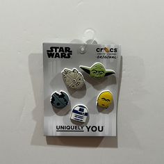 the star wars pin set is packaged in a package