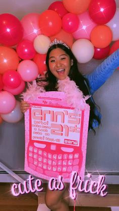 a girl holding up a pink and white sign with balloons in the background that says cute as flick