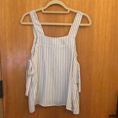 Blue And White Striped Top, Perfect Paired With White Jeans Or A Cute Skirt. Never Worn, Like New Condition. Us Size 2 Casual Tops With Tie Straps For Brunch, H&m Sleeveless Top For Day Out, H&m Blouse For Spring Vacation, Striped Blouse For Summer Brunch, Casual White Top With Tie Straps, Striped Sleeveless Blouse For Day Out, H&m Casual Summer Blouse, H&m Summer Casual Blouse, White Casual Top With Tie Straps