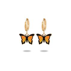 Add a touch of whimsy and color to your ensemble with our 18k Gold Plated Enamel Colored Butterfly Hoop Huggie Earrings! These beautifully crafted earrings feature enamel butterflies in a variety of vibrant colors, perfect for any occasion. Elevate your style and embrace your inner free spirit with these charming earrings! Details:- Huggie-Style Hoops- Dangling Butterfly Charm- 18k Gold Plated- Available in 3 Colors- ImportedDimensions:- 28mm x 18mm Trendy Enamel Huggie Earrings, Trendy Hypoallergenic Enamel Earrings, Black Enamel Hoop Earrings For Gift, Black Enamel Hoop Earrings As Gift, Gold Hoop Earrings With Black Enamel For Gift, Trendy Gold Enamel Earrings, Gold Enamel Hoop Earring (sold Individually), Gold Enamel Dangle Hoop Earrings, Yellow Gold Enamel Hoop Earrings For Pierced Ears