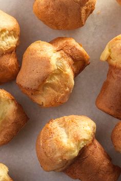 several muffins on a piece of parchment paper