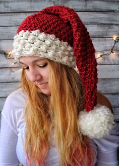 a woman wearing a red and white knitted hat