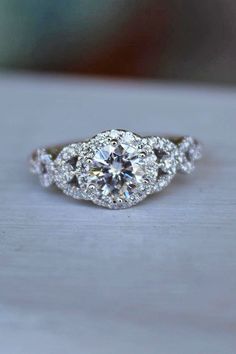 a diamond ring sitting on top of a table