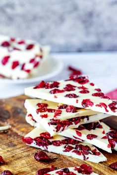 white chocolate and cranberry barkle on a cutting board