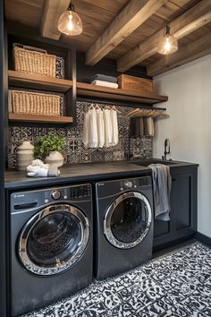 a washer and dryer in a room with wooden shelves on the wall above them