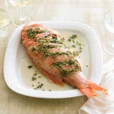 a piece of fish on a white plate