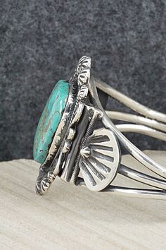 This beautiful turquoise and sterling silver bracelet was made by Navajo silversmith Jess Martinez. The inside is signed and stamped sterling.Size: 5 1/2" (will fit up to a 6 1/2" wrist)Gap: 1"Width: 1 5/8"Free shipping on all orders! We ship with USPS and always include tracking. All orders ship within a day of payment.Returns are accepted up to 30 days after you receive your order. Just send us a message. Our shop offers cash back or store credit. The item must be returned in new condition. Stamped Sterling Silver Bracelet In Turquoise, Stamped Turquoise Sterling Silver Bracelet, Southwestern Style Turquoise Bracelet Stamped 925, Sterling Silver Turquoise Stamped Bracelet, Unique Turquoise Bracelet Stamped 925, Unique Turquoise Bracelets Stamped 925, Southwestern Stamped Turquoise Sterling Silver Bracelet, Southwestern Turquoise Cuff Bracelet Stamped 925, Southwestern Turquoise Stamped Sterling Silver Bracelet