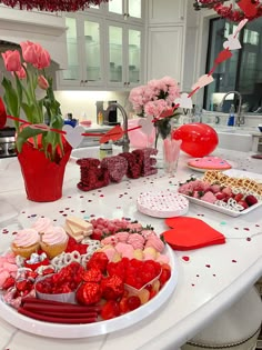 valentine's day dessert table with red and pink decorations