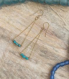 A beautiful, bohemian pair of lightweight 14K Gold Filled earrings. Made with turquoise beads and 14k gold filled chain.  Handmade in Santa Cruz and South Lake Tahoe, California DETAILS  - Findings and ear wires are 14K gold filled and great for sensitive ears - Turquoise beads - 14K gold chain - Each piece is handmade - please allow for slight variation - Approximately 2-2.5 inches long, not including ear wire, and approximately 0.8 inches wide at the widest point INCLUDED - Earrings are carefully packaged in a gift box - We ship in a bubble mailer to ensure maximum protection. CUSTOM ORDERS & GIFTS - Looking for something different or wanting a custom piece? Please contact me directly! RETURNS & EXCHANGES - Returns and exchanges are not available. However, if there is an issue with your Tahoe California, Lake Tahoe California, South Lake Tahoe, Gold Filled Earrings, Etsy Earrings Dangle, Lake Tahoe, Gold Filled Chain, Turquoise Beads, Gold Chains