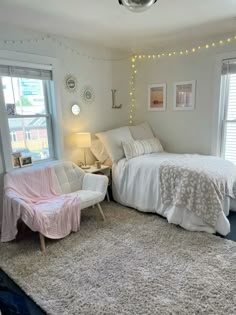 a bed room with a neatly made bed and a chair