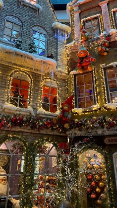 christmas decorations adorn the facade of a building