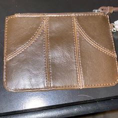 Brown Liz Claiborne Wallet With Wrist Handle, Brand New Never Used Brown Wristlet With Card Slots For Daily Use, Brown Pouch Coin Purse With Zipper Closure, Brown Pouch Coin Purse With Zipper, Brown Coin Purse With Zipper Closure, Brown Bifold Clutch With Zipper Closure, Brown Wristlet Clutch With Card Slots, Brown Clutch With Removable Pouch As Fashion Accessory, Brown Wristlet With Removable Pouch As Gift, Brown Leather Wristlet For Everyday Use