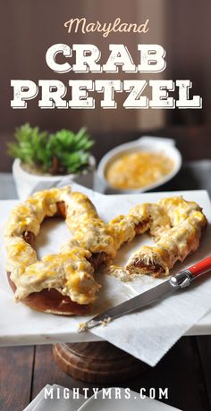 this is an image of crab pretzel on a cutting board with a knife