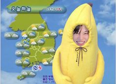 a person in a banana costume standing next to a map with clouds and rainclouds