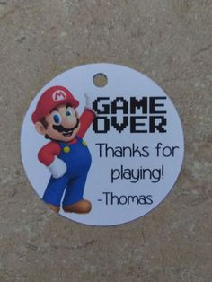 a white tag that says, game over thanks for playing - thomas with an image of mario