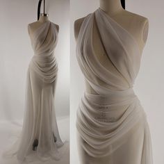 a white dress on display in front of a mannequin