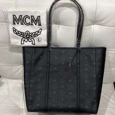 Brand New Black Mcm Tote With Mcm Cover Bag. High-end Black Bags For Daily Use, High-end Black Bag For Daily Use, High-end Black Bags With Branded Hardware, High-end Black Bag With Removable Pouch, High-end Black Shoulder Bag, High-end Black Shopping Bags, Luxury Black Shopping Bag, Classic Black Shoulder Bag With Dust Bag, Black Shoulder Bag With Logo And Double Handle