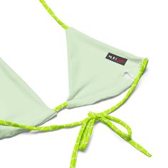 Stay comfortable and stylish all summer with this All-Over Print Recycled String Bikini set. It’s made from soft recycled polyester with double-layering and UPF 50+. Style the straps how you like, and get ready to swim! • Soft and stretchy material with UPF 50+ • Sizes up to 6XL • Bikini top comes with removable padding for comfort • Multiple ways to tie and style the bikini set • Color design options for swimwear lining Disclaimers: • Due to the 2-layered construction and internal stitching, a Trendy Nylon Swimwear For The Beach, Casual Strappy Swimwear For Sunbathing, Strappy Nylon Swimwear For Summer, Trendy Strappy Swimwear For Sunbathing, Summer Sports Swimwear With Adjustable Straps, Sports Swimwear With Adjustable Straps For Summer, Trendy Strappy Swimwear For The Beach, Bra-friendly Nylon Swimwear For Summer, Trendy Green Adjustable Swimwear