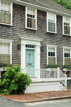 a house that has some plants in front of it