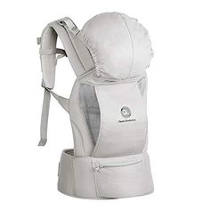 the baby carrier is white and has two straps on it