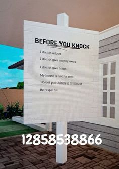 a sign that has been placed in front of a house with the words before you knock on it