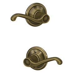 an image of two handles on a door handle and one is in satin brass color