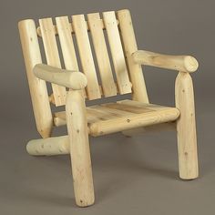 a wooden chair sitting on top of a gray floor