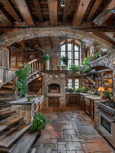 a kitchen with stone walls and stairs leading up to the second floor, along with potted plants