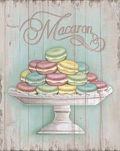 a wooden sign with macaroons on it