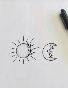 the sun and moon are drawn on paper