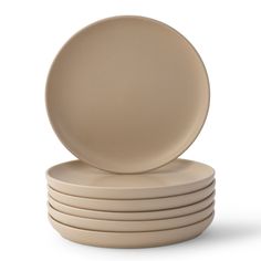 a stack of beige plates sitting on top of each other