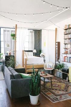 a living room filled with furniture and lots of books