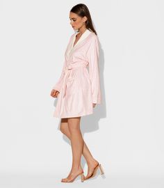 Ideal for a spa get-away or staycation, the Pink Stripes short robe is made from luxurious microfiber for that all day loungewear vibe. The flattering classic striped print includes a matching belt for cinching at the waist. One size Short bath/lounge Robe Shawl collar 2 bottom side pockets Sewn in belt Made of soft and absorbent microfiber Machine wash cool Tumble-dry low Fitted Pink Robe For Daywear, Pink Summer Robe For Bedtime, Pink Cotton Robe For Daywear, Pink Summer Sleep Robe, Pink V-neck Robe For Loungewear, Lounge Robes, Shawl Collar, Pink Stripes, Striped Shorts