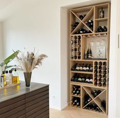 a wine rack in the corner of a room