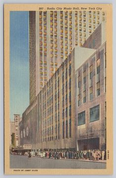 an old postcard shows people walking in front of a large building with many windows