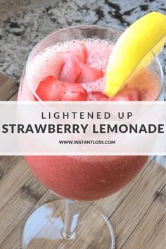 a strawberry lemonade drink in a glass with the text lightened up strawberry lemonade