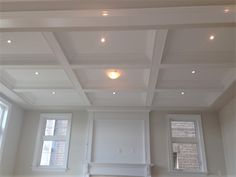 an empty living room with white walls and ceiling