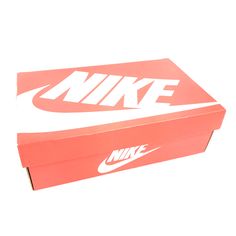 a pink nike box sitting on top of a white table