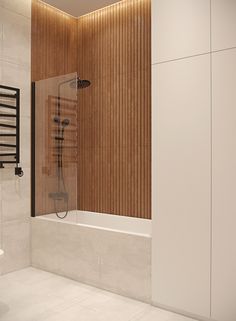 a bathroom with a sink, toilet and bathtub next to a wooden paneled wall