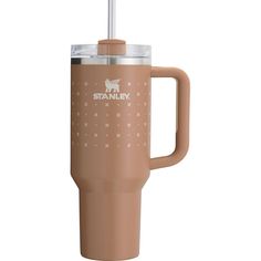 a tan travel mug with a straw sticking out of the lid and handle that says stanley on it