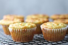 several muffins are sitting on a cooling rack