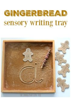 gingerbread writing tray with gingerbread cutouts on it and the words gingerbread written in small letters