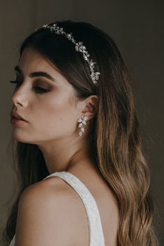 A tribute to the garden, the Evelyn crystal earrings feature cascading leaf details to add an element of of organic styling to your bridal look. These crystal earrings will add texture and softness to your bridal ensemble and pair beautifully with modern, traditional or bohemian-inspired gowns with leaf and floral motifs.• DETAILS •> Designed in Australia. Worldwide shipping> Cubic zirconias, silver plated settings> Dimensions: 36mm> Colour: Silver or gold plated*Styled with the RUBE Wedding Hairband Hair Down, Wedding Hairband Hairstyle, Crystal Bridal Headband, Floral Hairband, Wedding Hair Headband, Crystal Tiara, Crystal Bridal Earrings, Wedding Hair Down, Vintage Style Wedding