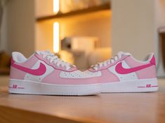 Step up your sneaker game with our Custom Pink Nike Air Force 1 Sneaker! These bold kicks will make a statement as you take on any challenge. The unique design adds a touch of risk-taking to your style. Step out in confidence and show off your adventurous side with these sneakers. 🔥 100% genuine, Brand New.👟 Custom sneakers.★Every pair is hand-made and unique.✨Best quality waterproof and scratch-proof paints used.🎉 1000+ satisfied customers across various platforms.🎁 Treat the shoes as art a Pink Air Force 1, Pink Nike Air, Custom Af1, Unique Sneakers, Air Force 1 Custom, Lv Shoes, Baskets Nike, Pink Nike, Nike Brand